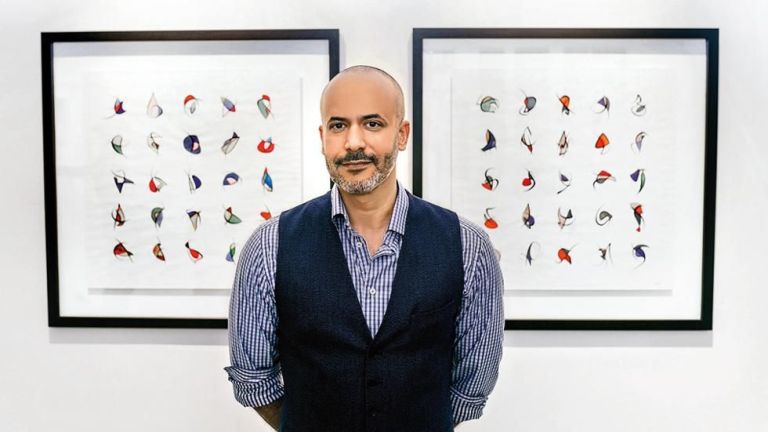 Majid Alyousef: Crafting a Contemporary Canvas through Calligraphy Majid Alyousef, a contemporary calligraphy artist, creating an abstract artwork that blends traditional Arabic script with modern artistic elements.