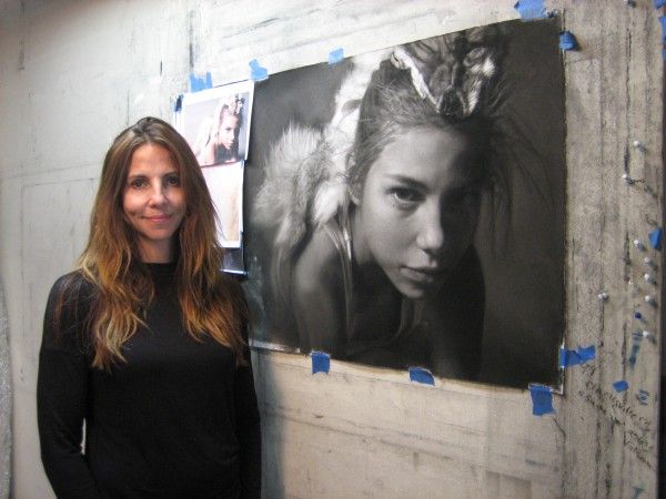 Annie Murphy: The Artist Behind Vignettes of Charcoal Memories Hyper-realistic charcoal drawing by Annie Murphy-Robinson depicting a vulnerable figure in silent reflection, surrounded by intricate details.