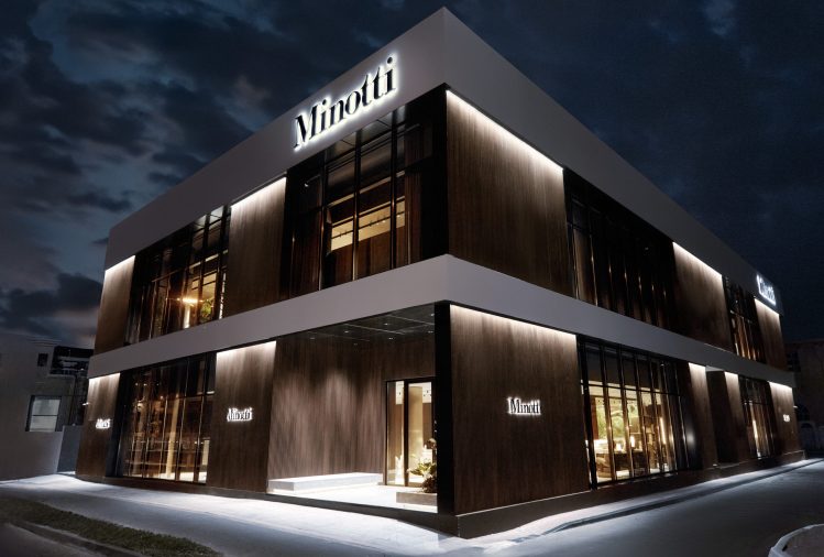 MINOTTI announces the opening of its new flagship store in Dubai with partner Al Tayer Insignia Exterior view of Minotti Dubai flagship store, showcasing a modern architectural facade with a large portal entrance.
