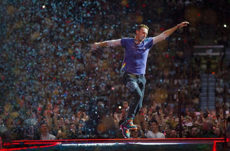Coldplay Live in Abu Dhabi: One-Night-Only Concert, tickets from AED 82 Coldplay performing live on stage during their Music Of The Spheres tour at Zayed Sports City Stadium in Abu Dhabi, January 2025.