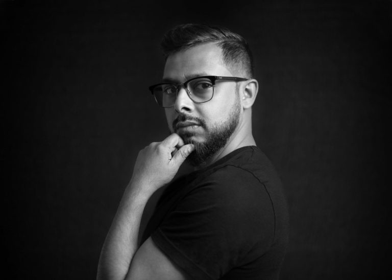 Ruh Al-Alam: Bridging Traditional Techniques and Modern Aesthetics in Art Ruh Al-Alam creating an artwork that blends traditional Arabic calligraphy with modern design elements, showcasing his unique artistic style.