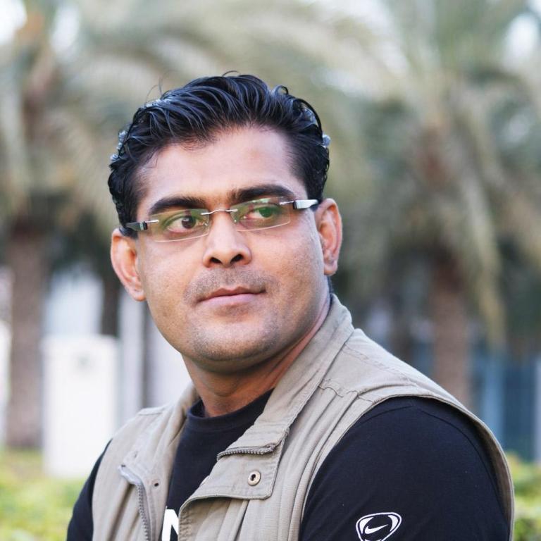 Khaleelullah Chemnad: The Maestro of Anatomic Calligraphy Khaleelullah Chemnad, a pioneering calligraphic artist, poses with one of his detailed anatomic calligraphy artworks.