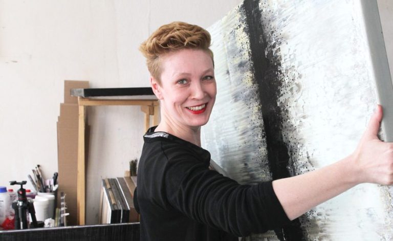 Lali Torma: A Fusion of Abstract Expressionism and Asian Art Lali Torma creating a vibrant abstract painting, showcasing her unique artistic style and intuitive approach.