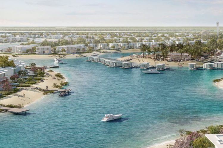 Ramhan Island to Feature Floating Villas An aerial view of Ramhan Island in Abu Dhabi, showing the turquoise blue waters and lush greenery of the island, with the city skyline in the distance