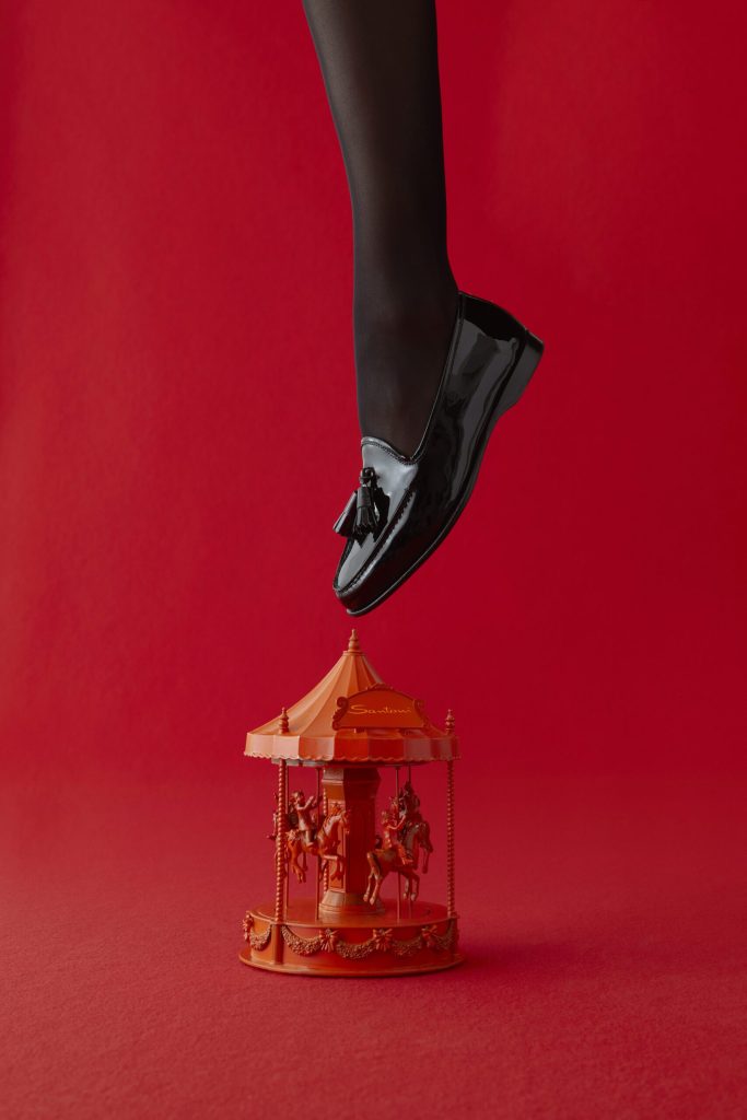 Santoni’s Magical Holiday: Embrace Festive Charm with Arancio Santoni Image of Andrea loafer: "Santoni Andrea Loafer in Festive Holiday Setting"