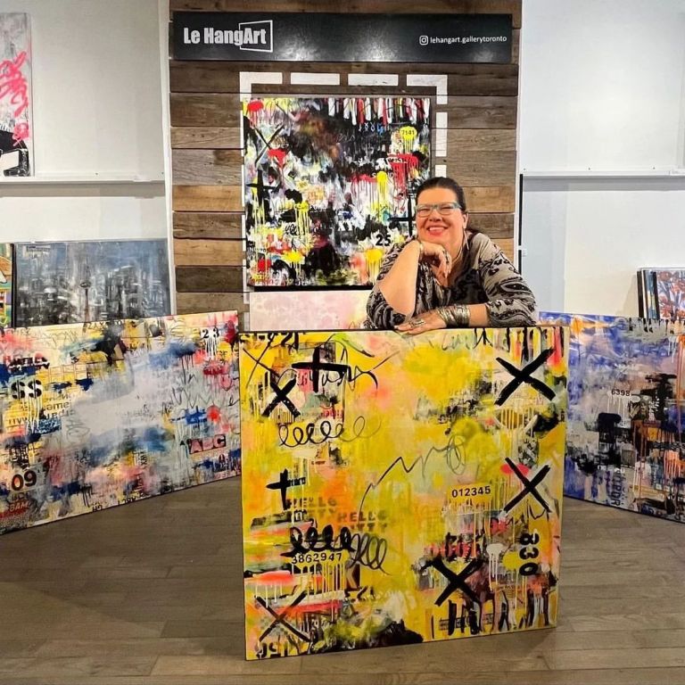 Lorette C. Luzajic: A Dynamic Force in Contemporary Art through Pop Art Lorette C. Luzajic in her studio surrounded by her eclectic artwork, embodying her dynamic and multifaceted approach to contemporary art.